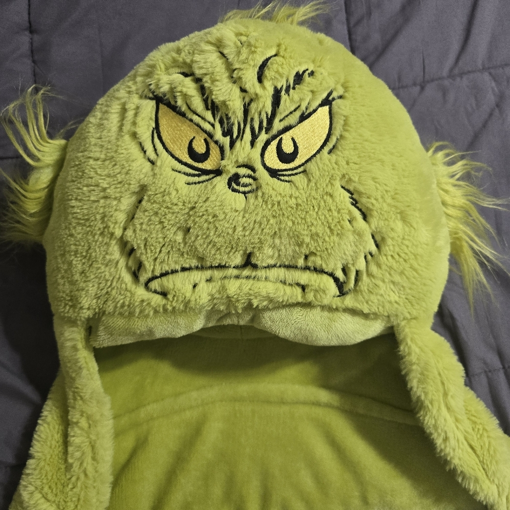 Cozy green hooded blanket featuring The Grinch